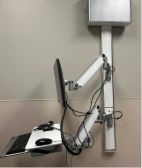 Wall-mounted articulated workstation assembly